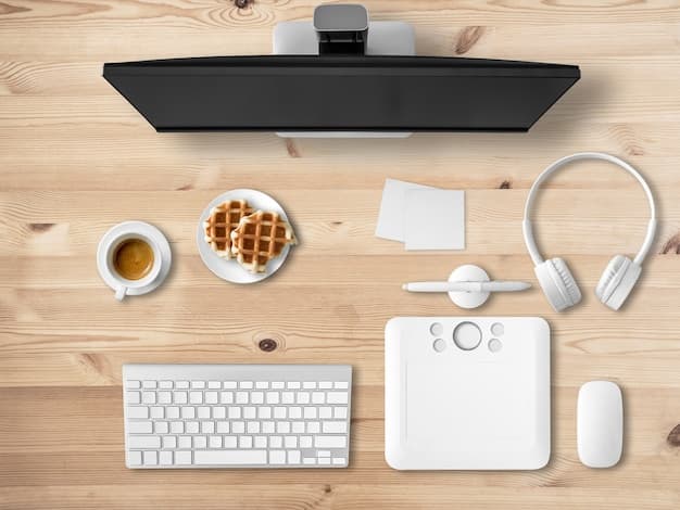 A clean and organized desk with a laptop, notebook, and a cup of coffee.