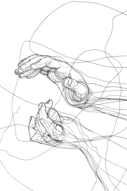 A hand drawing a simple wireframe on a piece of paper