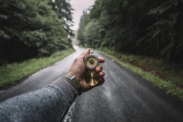 A person looking at a compass with a clear path ahead