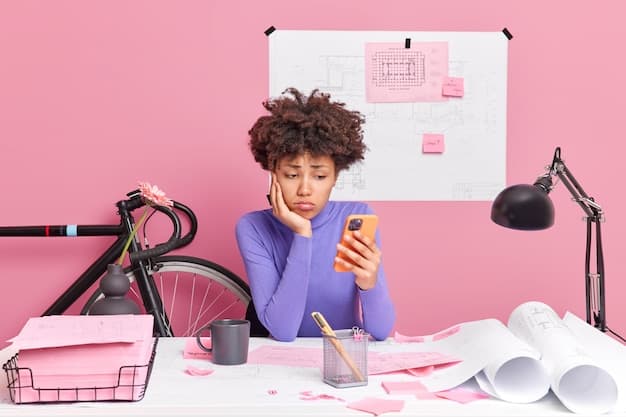 A person looking stressed at a computer screen with the word "MARKETING" in large, bold letters.