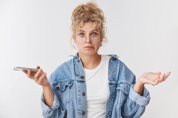 A person trying out a new app on their phone, looking confused