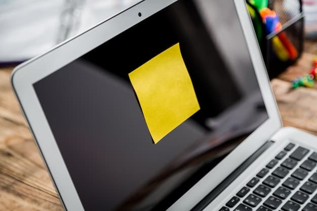 A sticky note on a laptop screen with a simple task written on it