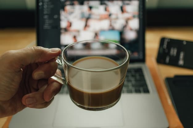Two people having a virtual coffee chat on a laptop